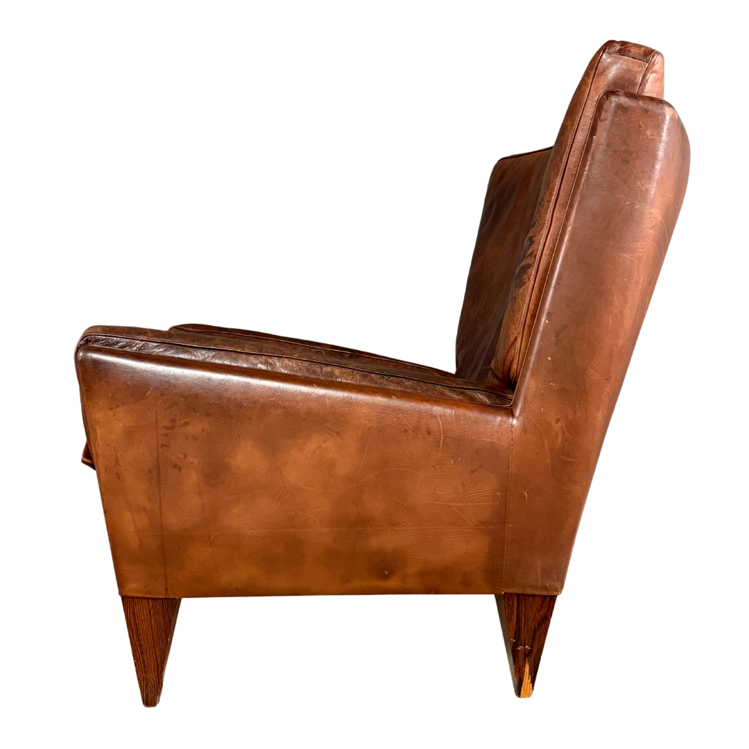 1960s Illum Wikkelso : Model V11 leather lounge chair + ottoman