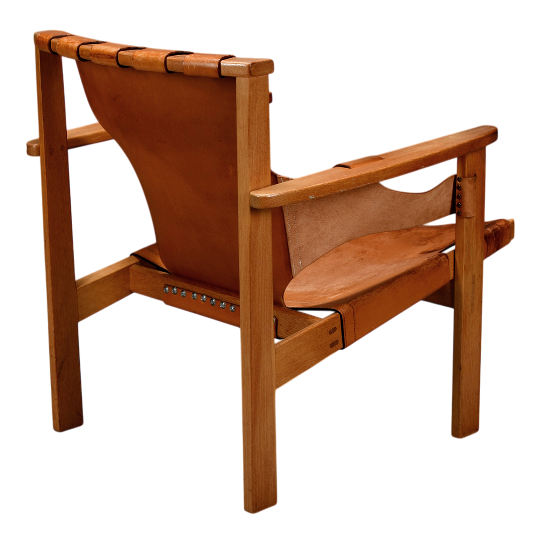 1950s Carl-Axel Acking : "Trienna" saddle leather & oak armchair
