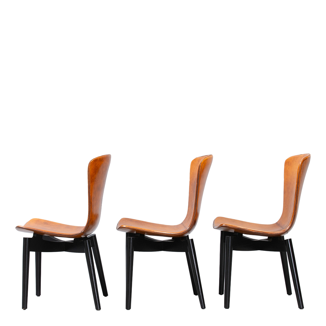 c2010 Michael W. Dreeben : shell dining chairs in cognac leather for Mater