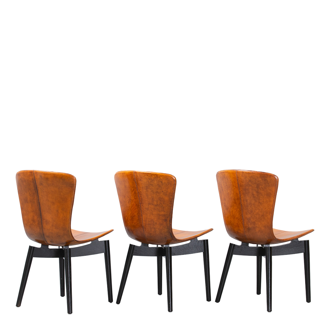 c2010 Michael W. Dreeben : shell dining chairs in cognac leather for Mater