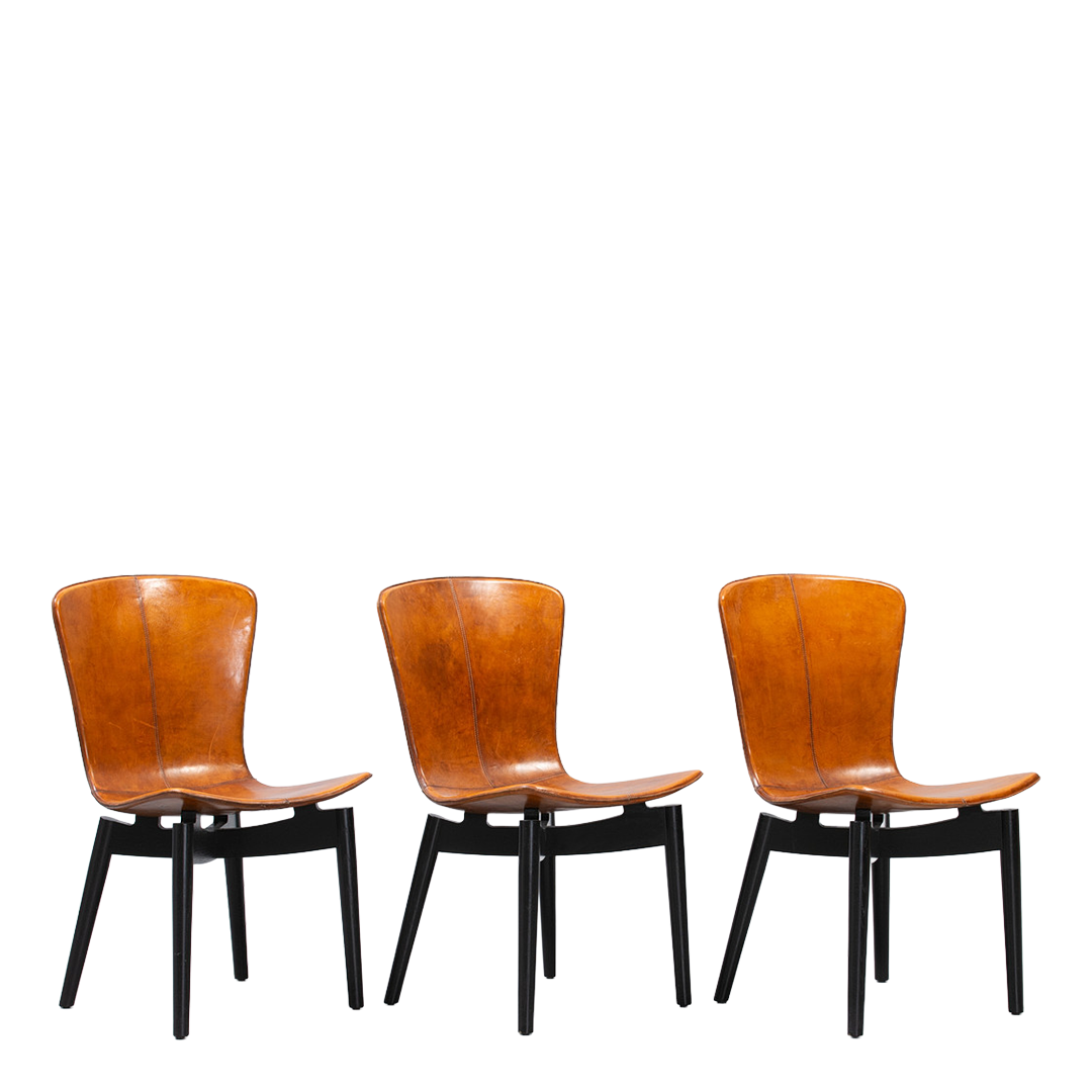 c2010 Michael W. Dreeben : shell dining chairs in cognac leather for Mater