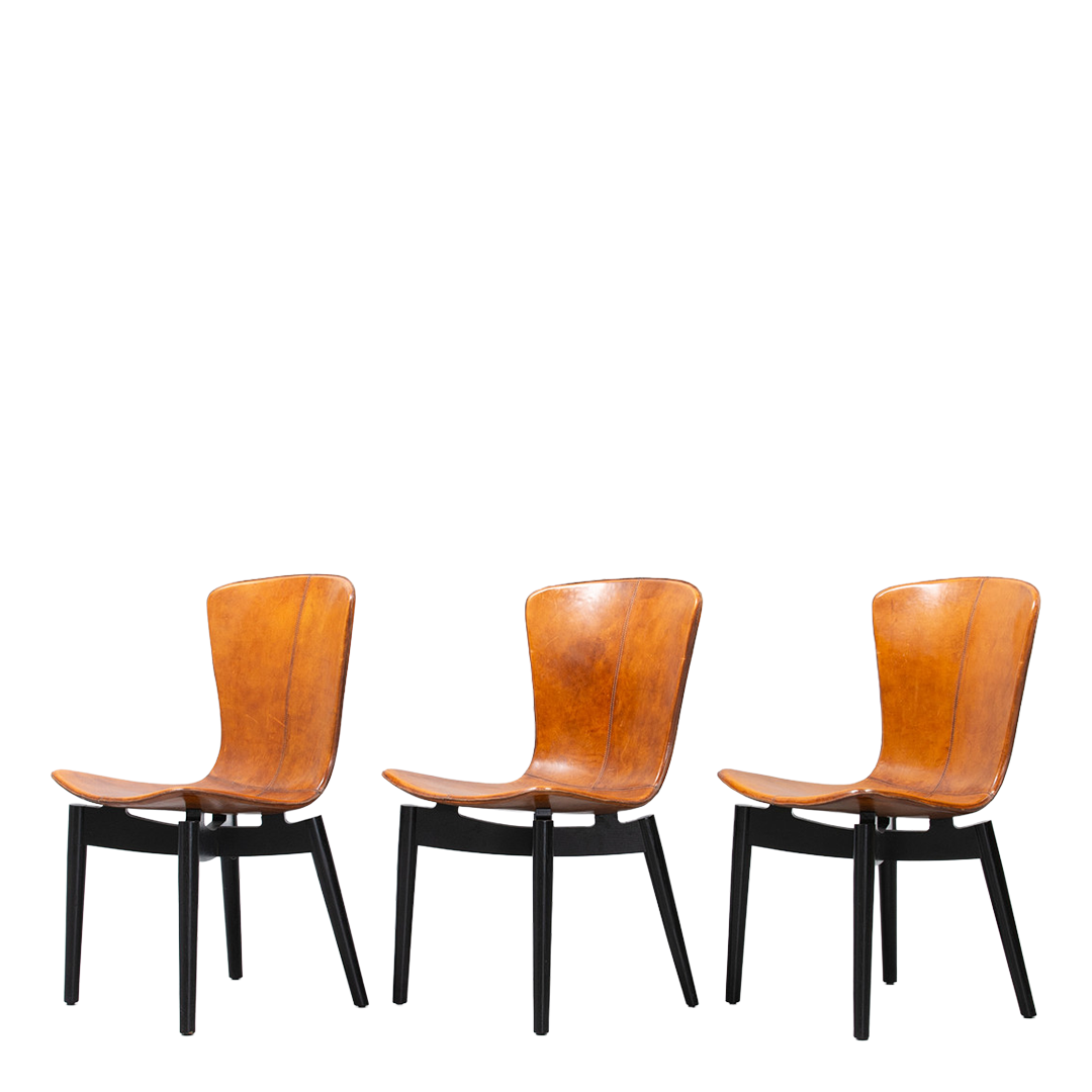 c2010 Michael W. Dreeben : shell dining chairs in cognac leather for Mater