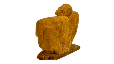 Signed hand carved/hewn figure of a seated man