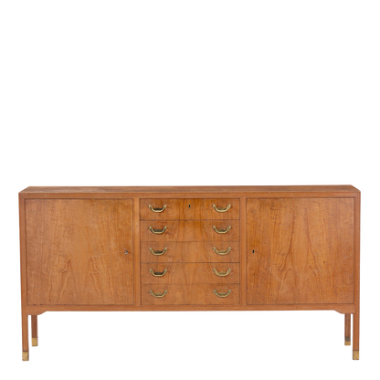 1960s Danish: teakwood 70" credenza w/central drawers & brass detail
