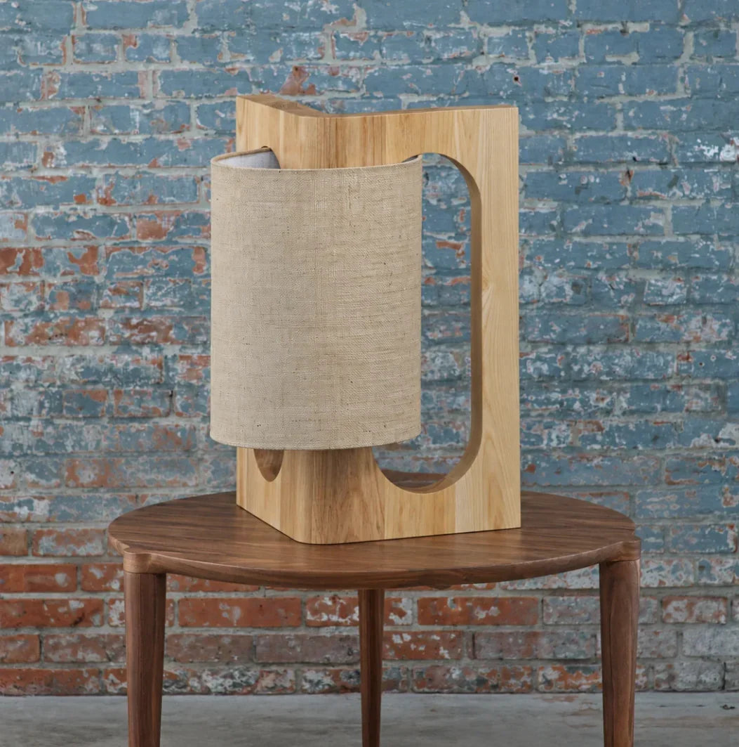 Prague table lamp in light oak on a walnut side table
